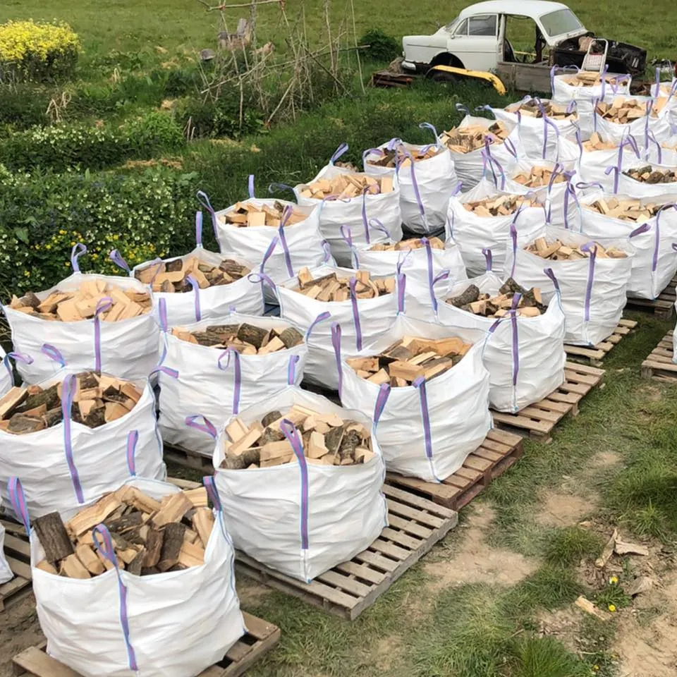 Rows of tonne bags lined up on pallets in the field