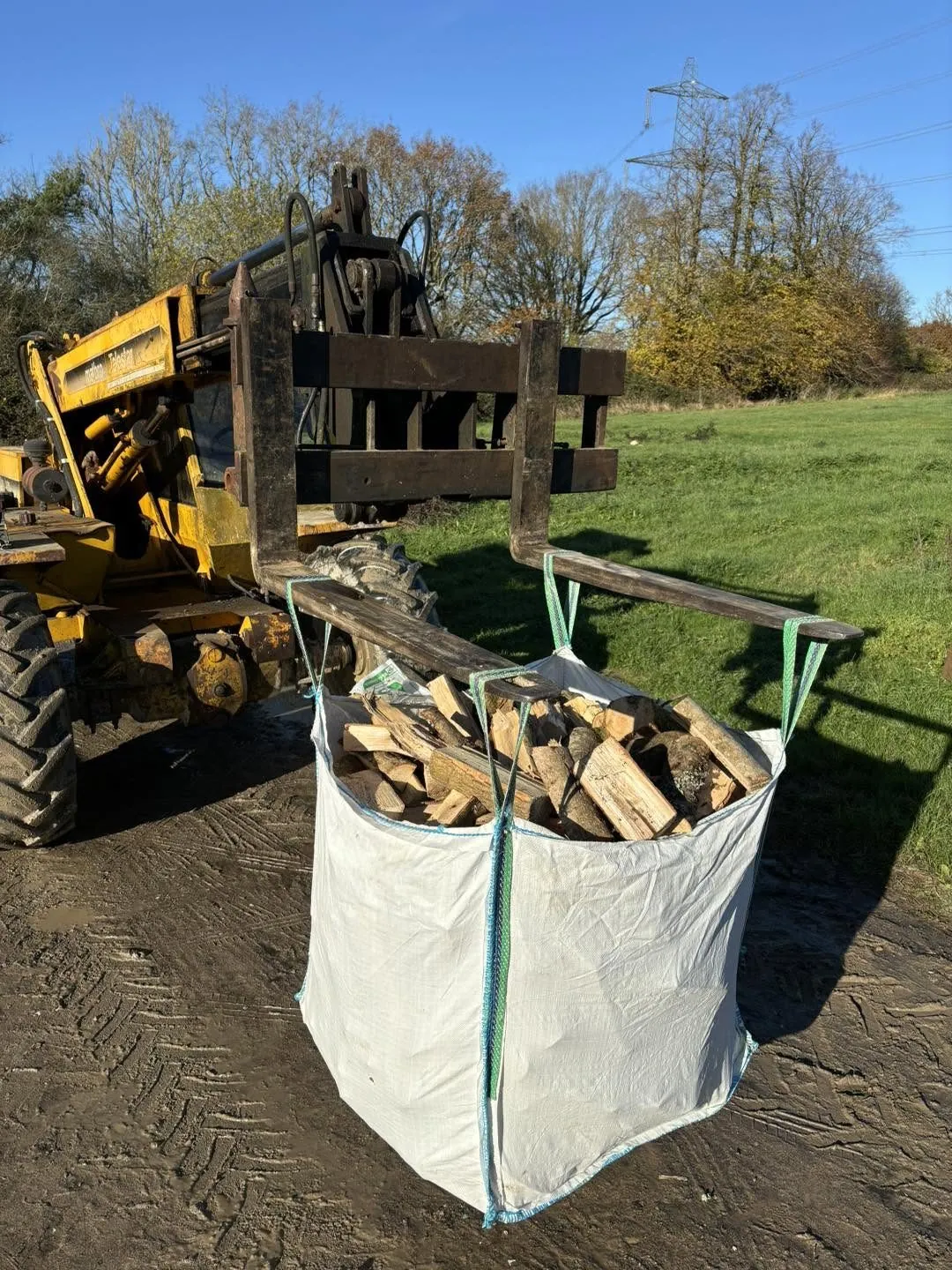 A tonne bag of split logs on the forklift at the yard