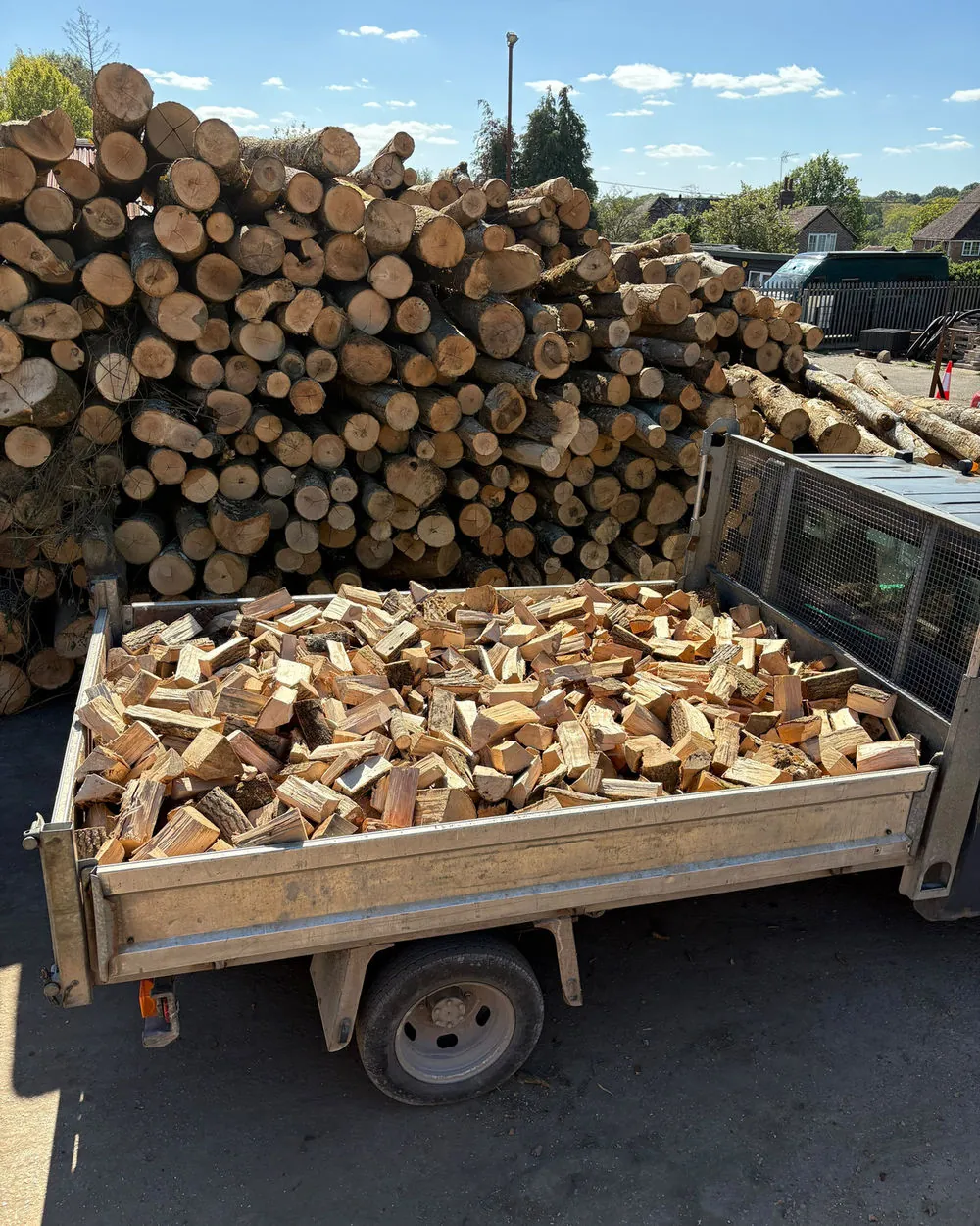 A T & H Logs tipper loaded with split seasoned hardwood at our West Sussex yard
